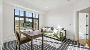 Living room featuring an office area and recessed lighting
