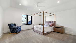 Bedroom with ceiling fan, light carpet, lofted ceiling, and recessed lighting