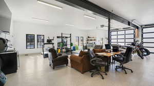 Office with dark aggregate flooring