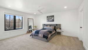 Bedroom with carpet, ceiling fan, and recessed lighting