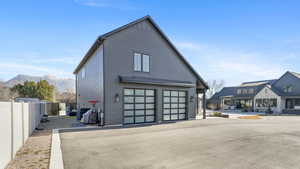 View of side of home featuring a mountain view
