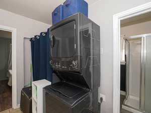 Laundry area with stacked washing machine and dryer