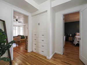 Hallway featuring light wood finished floors and wooden ceiling