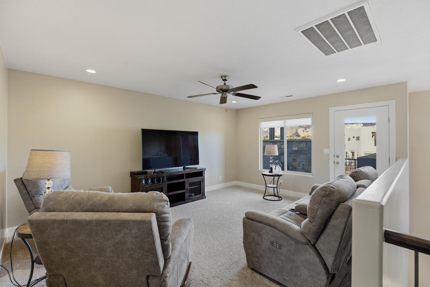 Living room with carpet floors, recessed lighting, and a ceiling fan
