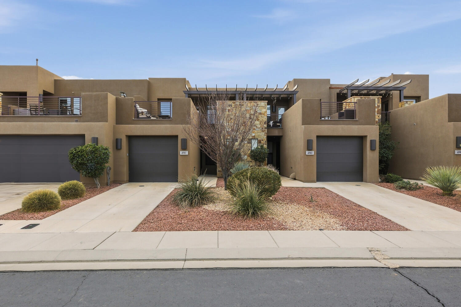 Southwest-style home featuring stucco siding and concrete driveway