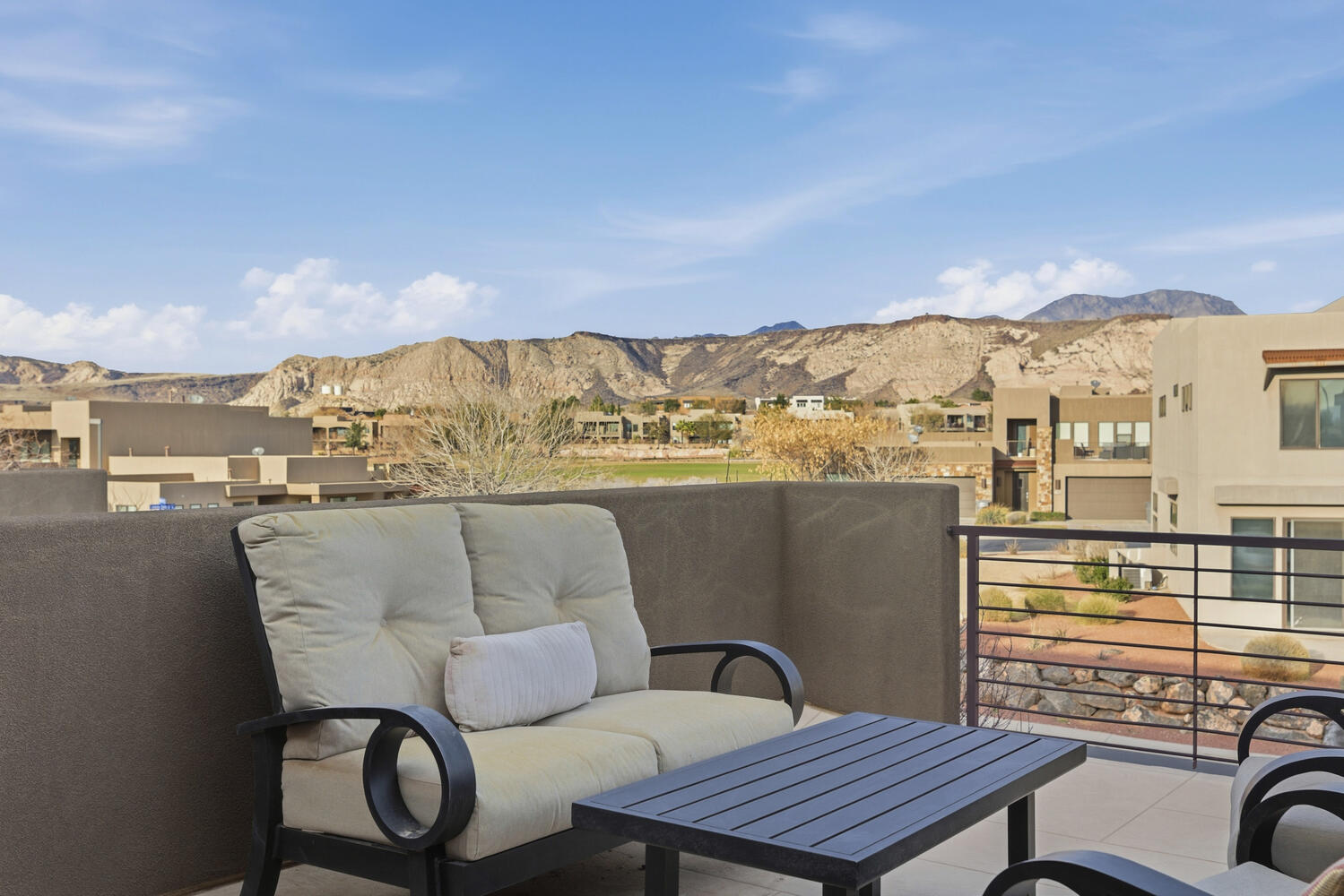 Balcony featuring a mountain view and a residential view