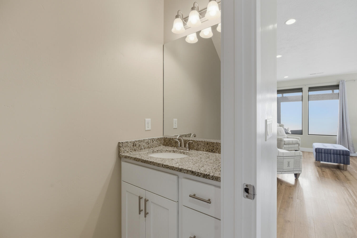 Bathroom with vanity, recessed lighting, and light wood-style floors