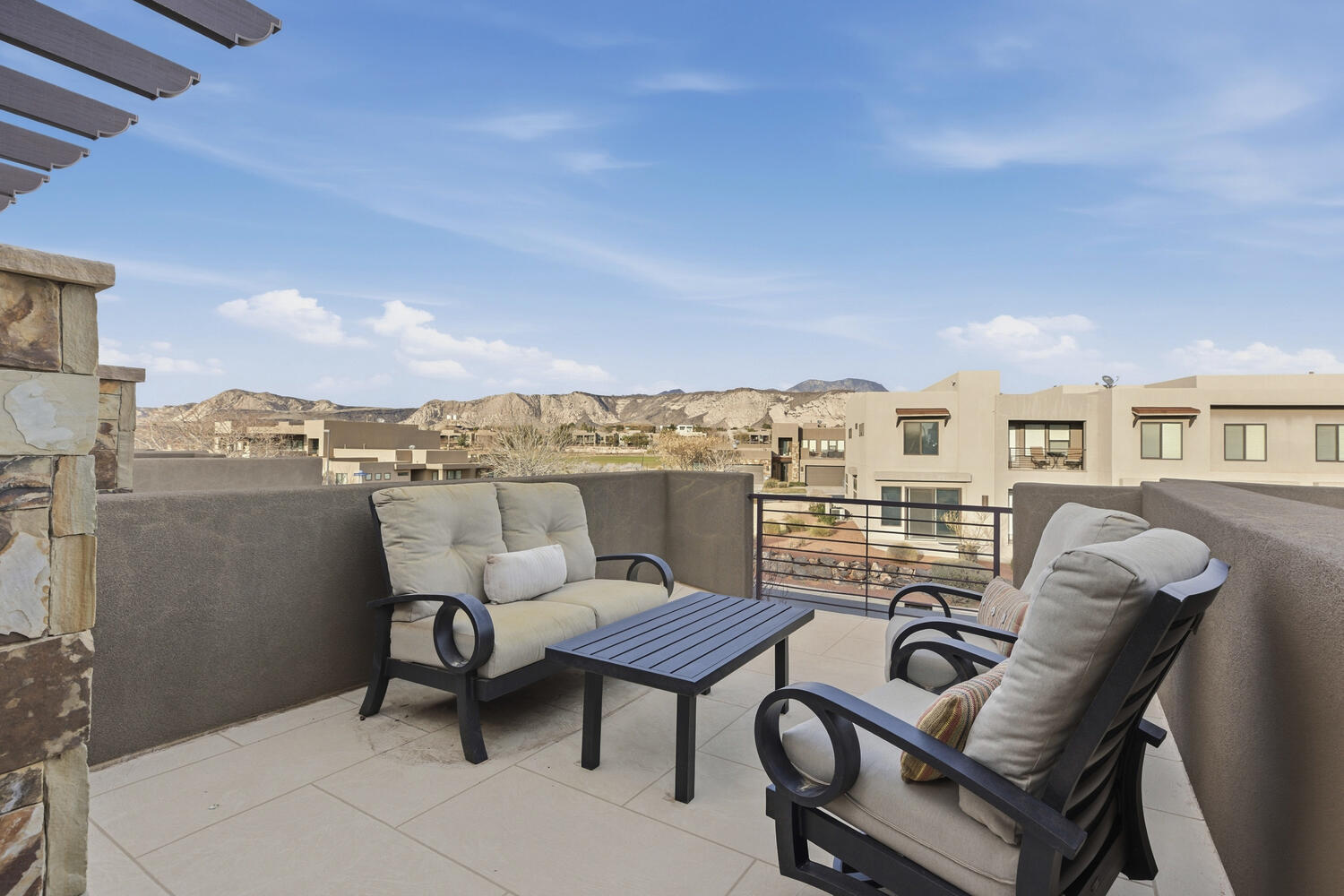 Balcony with a residential view and outdoor seating