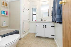 Bathroom with vanity and shower / bath combination