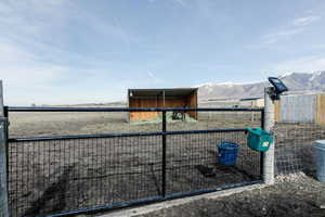 Exterior view of a mountain backdrop and an exterior structure
