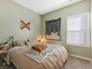 Bedroom with carpet and baseboards