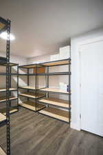 Shelving moving out, this bedroom connects to the laundry/bathroom.