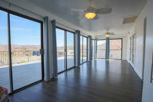 Unfurnished sunroom featuring a mountain view