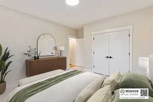 Bedroom #3:  featuring multiple windows and carpet. This room is virtually staged.