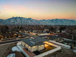 Aerial view at dusk of a residential view and a mountain view