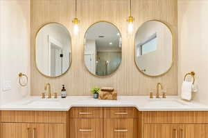 Full bathroom with an over sized shower, free standing tub and double vanity