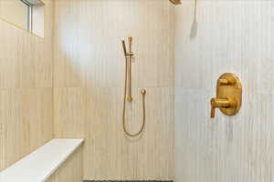 Full bathroom with a tile shower