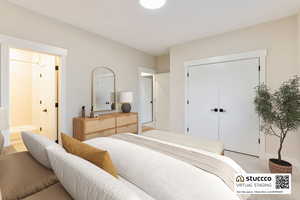 Bedroom #2: Carpeted bedroom on the main floor, with direct access to a full shared bathroom. This room is virtually staged.