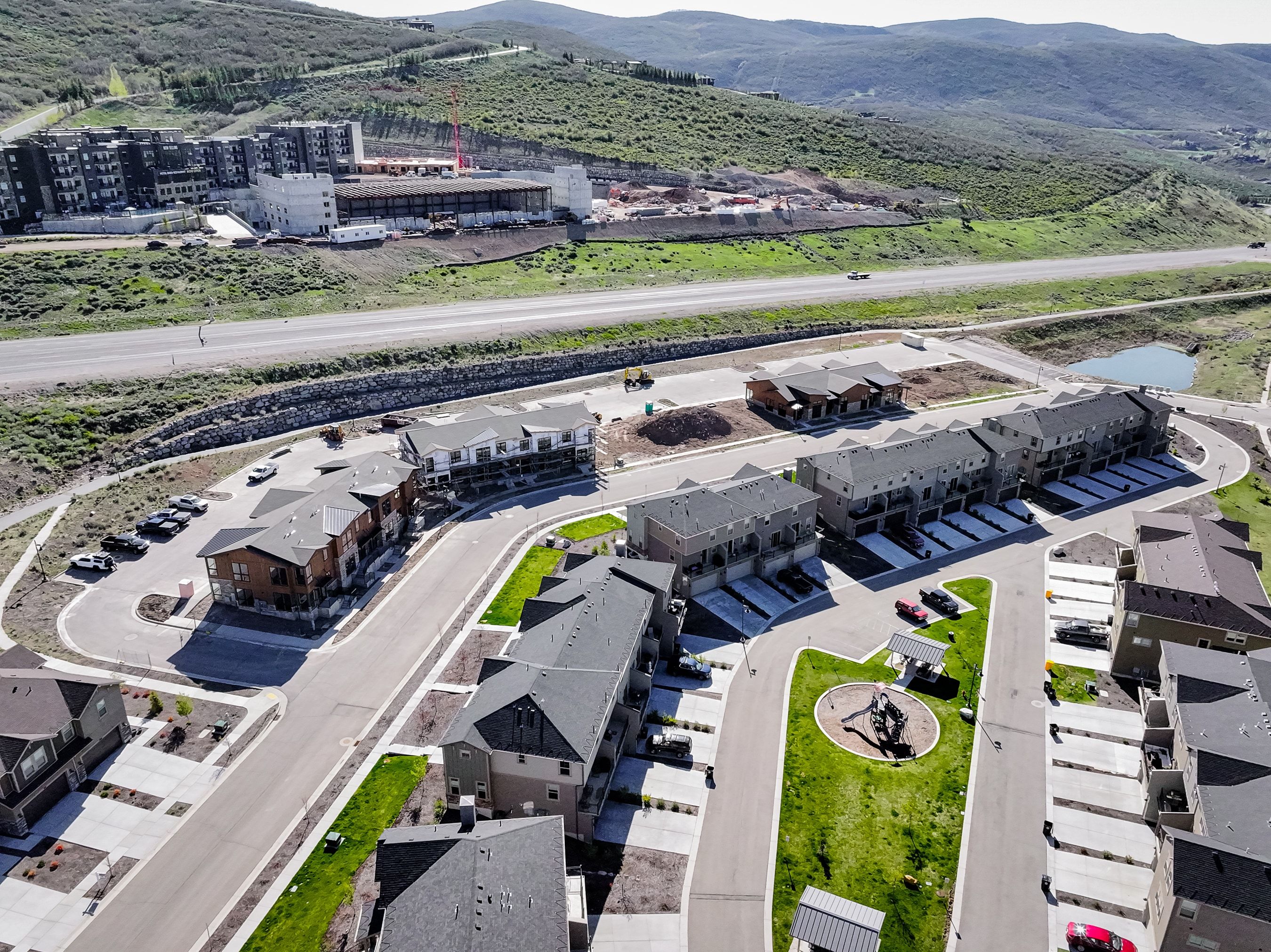Aerial view of property and surrounding area with a mountainous background
