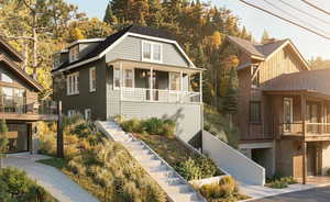 View of front of property featuring stairway