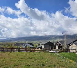 View of yard with a mountain view and a rural view