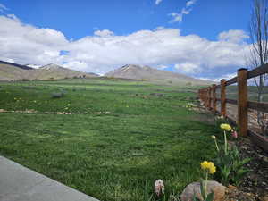 View of yard with a mountain view and a rural view