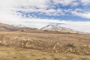 View of mountain backdrop featuring rural landscape