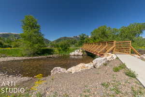 View of yard with a water and mountain view