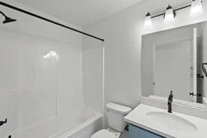 Bathroom featuring vanity and bathing tub / shower combination