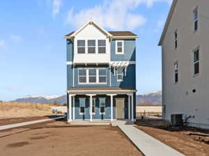 View of front of property featuring a mountain view