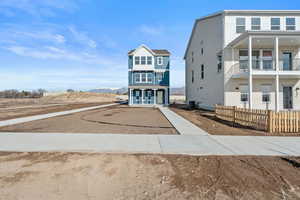 Raised beach house featuring a mountain view