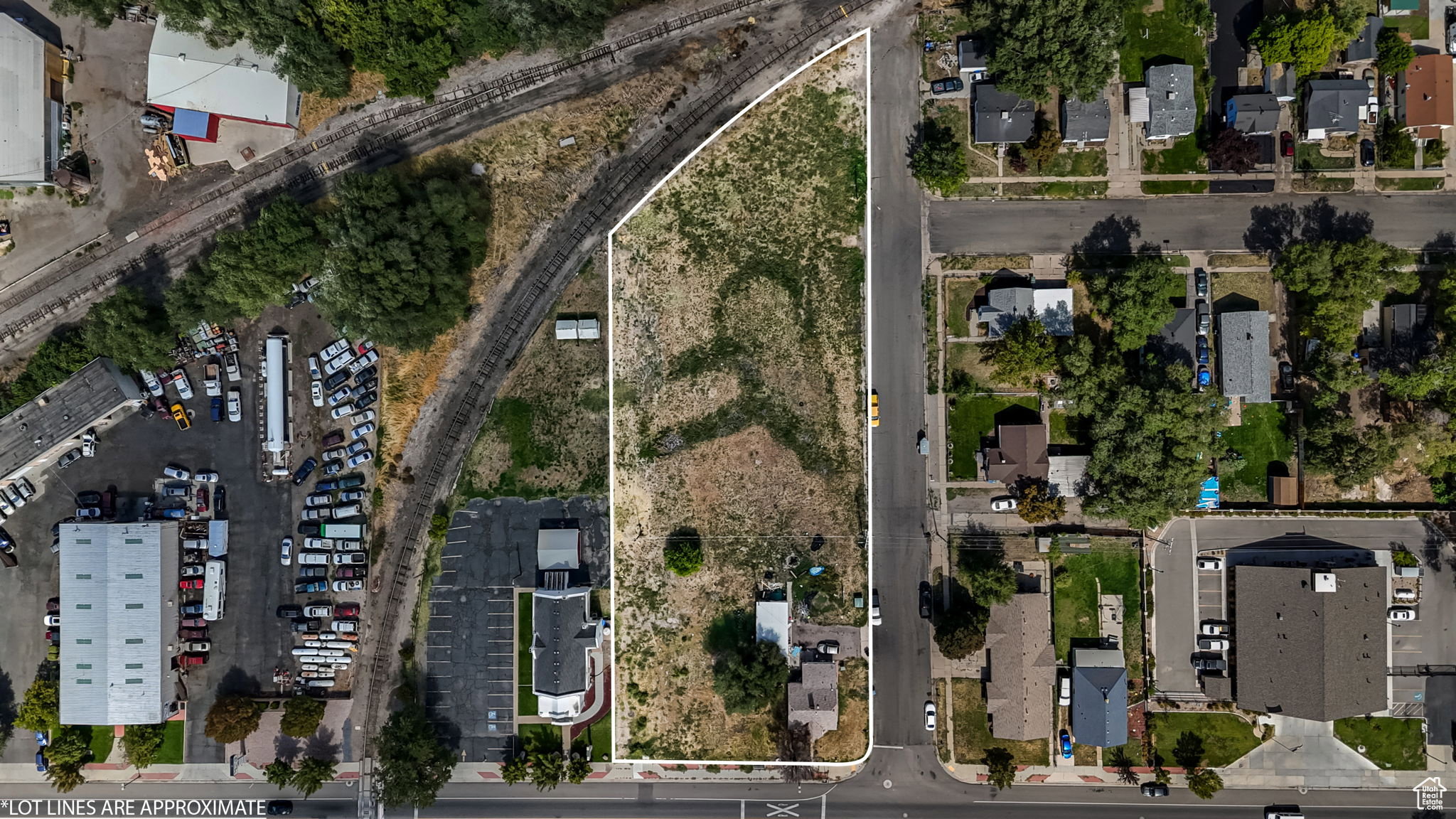 Aerial view of residential area with property parcel outlined