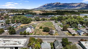 Aerial perspective of suburban area with a mountain backdrop