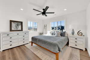 Bedroom with ceiling fan, light wood finished floors, and recessed lighting