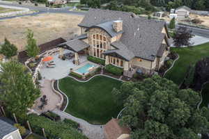 Aerial view of property and surrounding area with a pool area