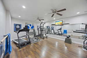 Workout area with a ceiling fan and recessed lighting