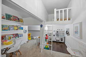 Recreation room with dark wood-style floors