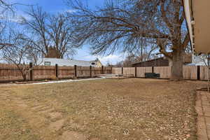 View of fenced backyard