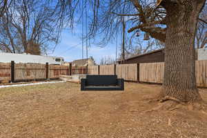 View of fenced backyard