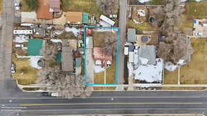 Aerial perspective of suburban area featuring property boundaries highlighted