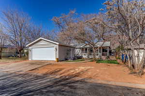 View of front of property featuring driveway and a garage