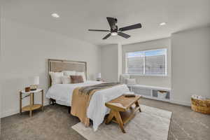 Bedroom with carpet floors, ceiling fan, and recessed lighting