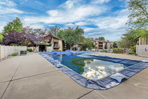 Community pool featuring a patio