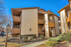 View of apartment building / complex featuring stairs