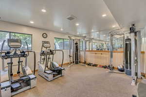 Workout area featuring recessed lighting