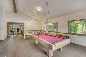 Recreation room featuring french doors, light colored carpet, pool table, vaulted ceiling, and ceiling fan