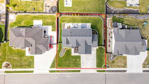 Aerial perspective of suburban area featuring property parcel outlined