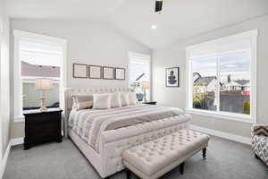 Bedroom featuring carpet flooring, lofted ceiling, ceiling fan, and recessed lighting