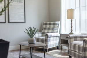 Living area featuring baseboards and wood finished floors