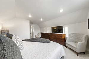 Bedroom featuring vaulted ceiling, carpet flooring, and recessed lighting